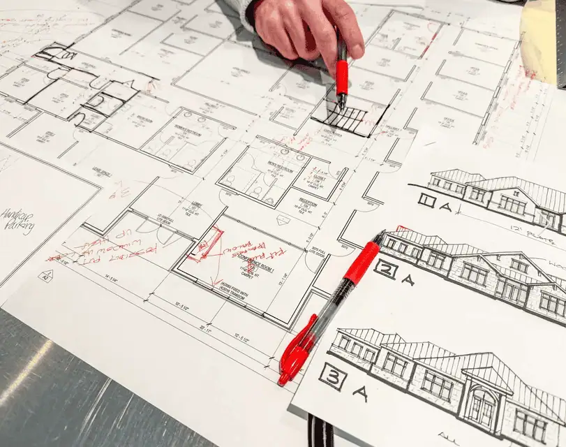 Reviewing a design set with red pens